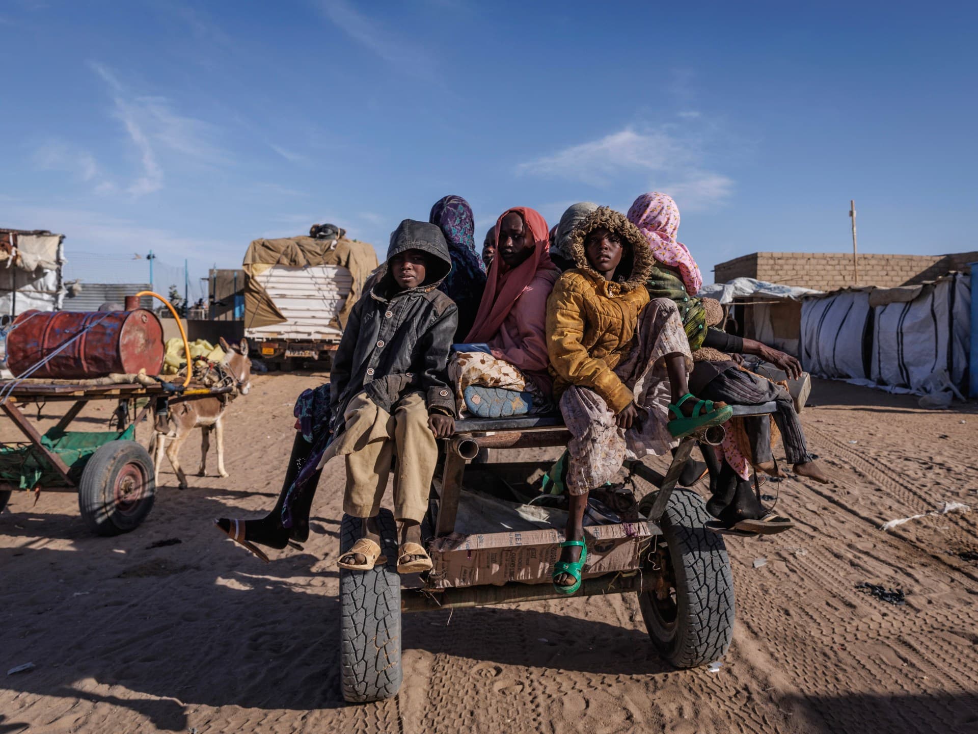 File photograph: Sudanese refugees prepare to ride back to their temporary shelter in Oure Cassoni, Chad