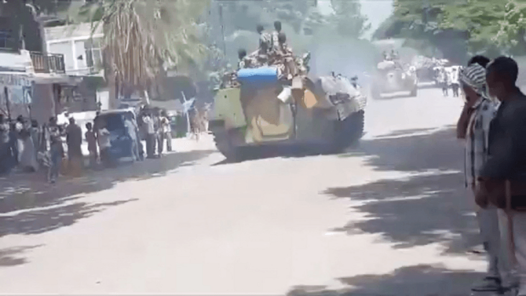 People look on as army tanks drive through a street in Alamata, Tigray, 28 September 2026 (screengrab from social media video).