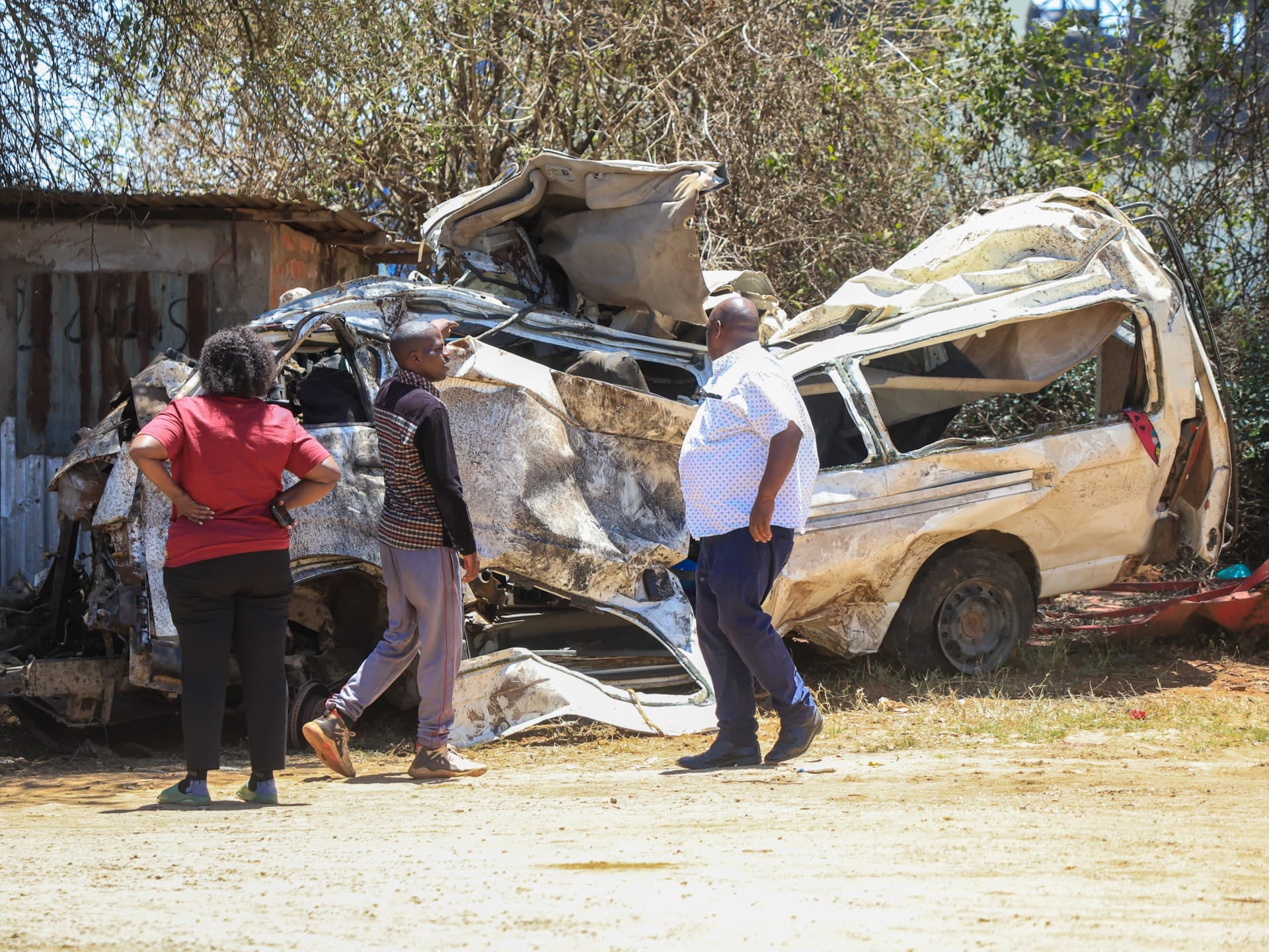 People view the wreckage of a minibus that was involved in an accident killing all the passengers, in the Salama area in eastern Kenya, on October 3, 2026.