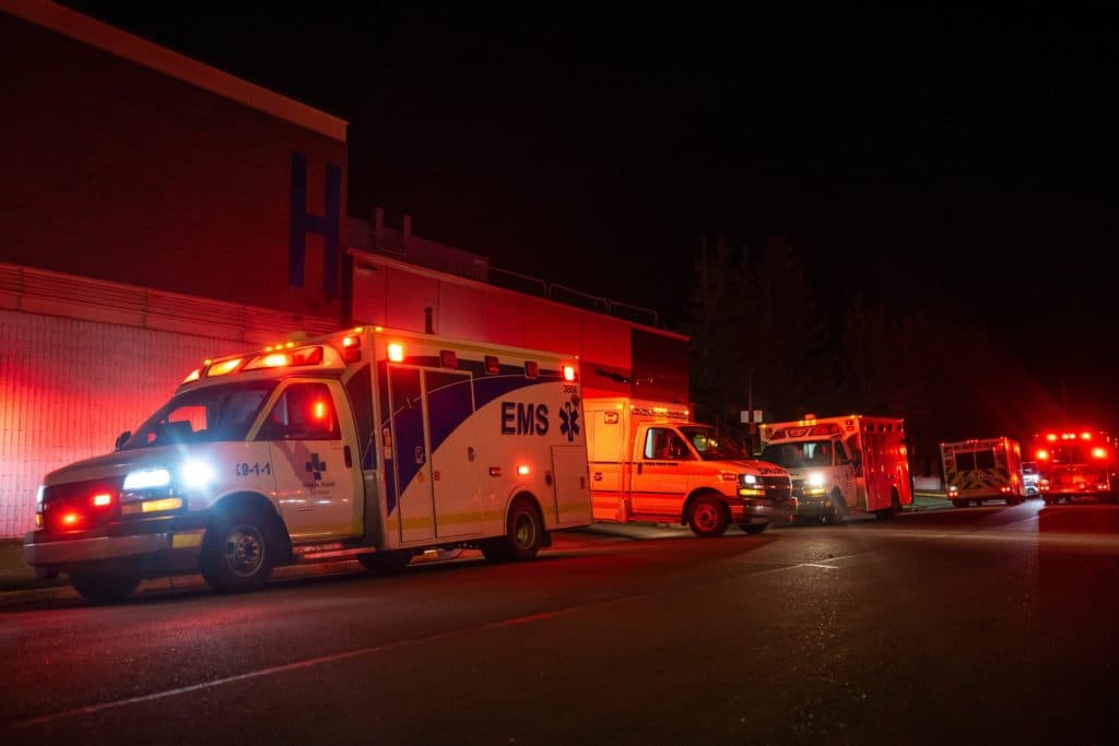 Ambulances outside the Wainwright Health Centre as injured military members are treated after the fire at CFB Wainwright, Alberta, on 17 October.