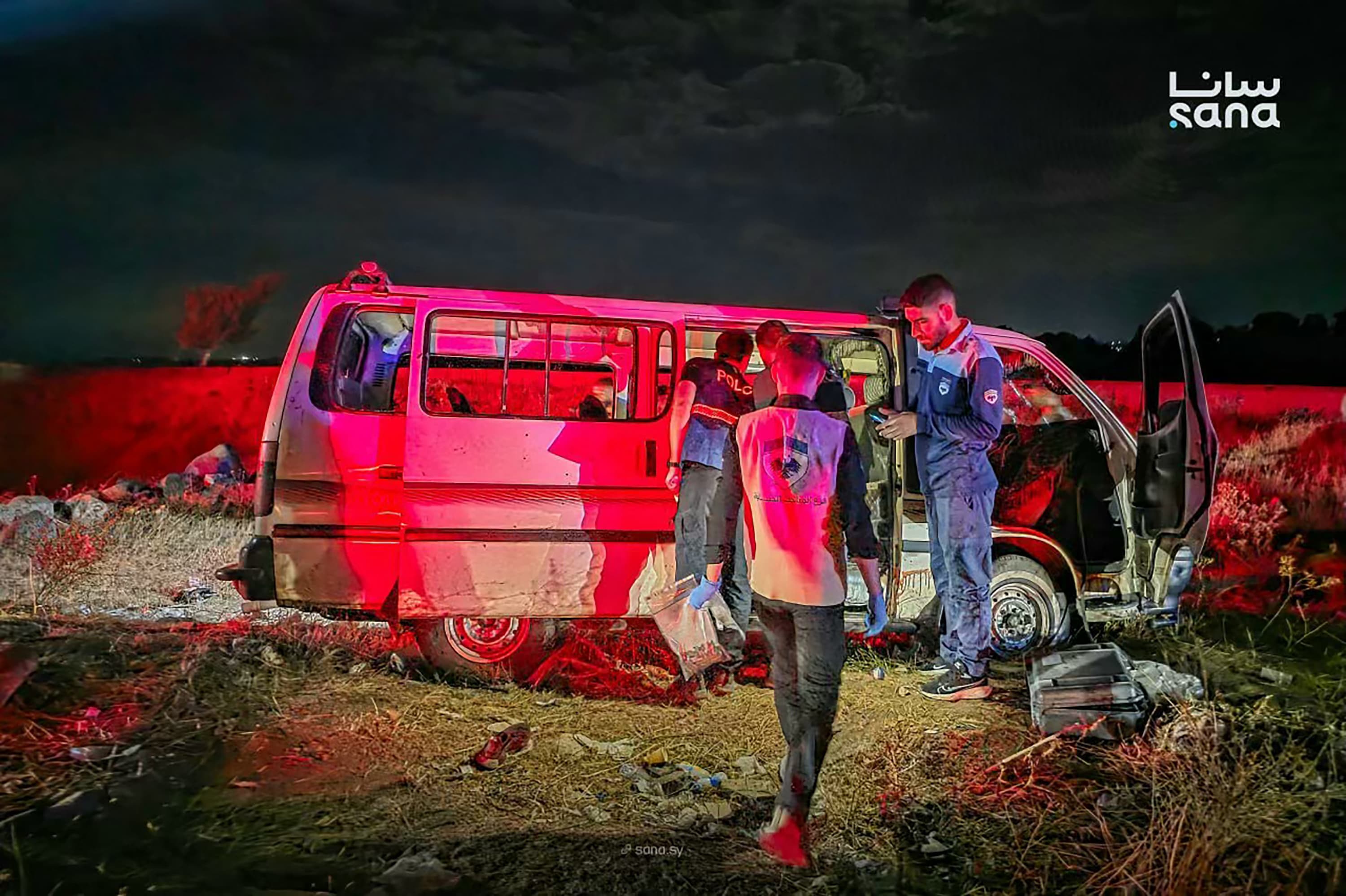 Investigators examine the civilian bus attacked on the Masyaf bridge in Homs province, Syria, 30 September 2026.
