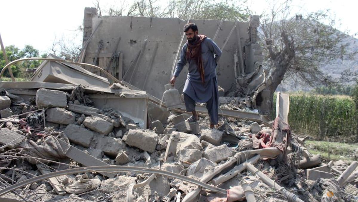 A man retrieves belongings from the debris of a house that was damaged in what the Taliban said was a Pakistani airstrike in Kunar province, Afghanistan, on Sep 21, 2026. (Photo…