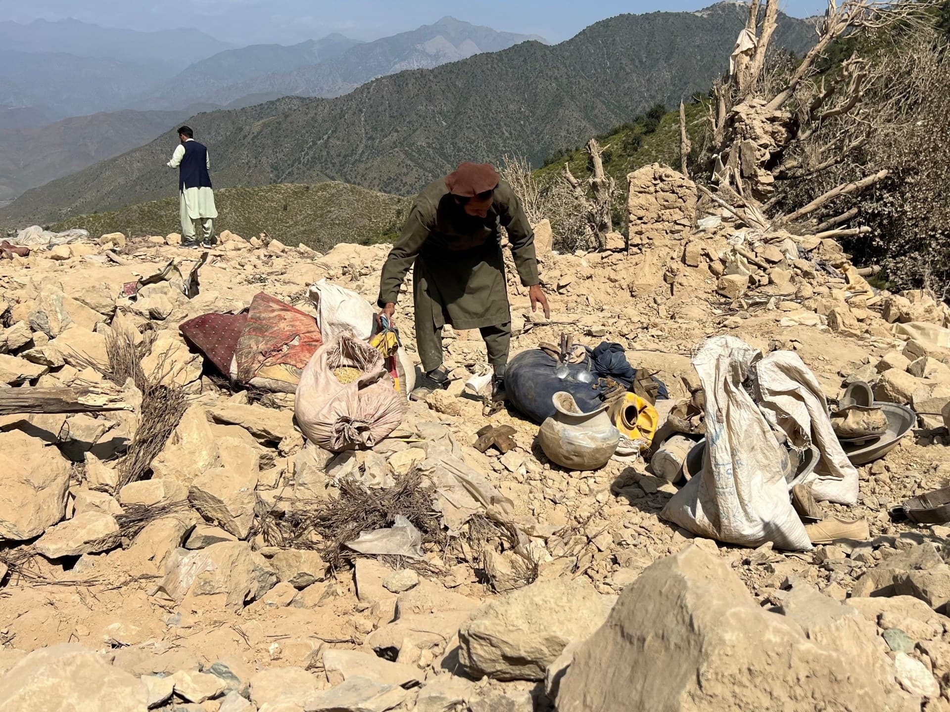 A man salvages his belongings from the debris of his house, which was damaged in an air attack in Shultan, Kunar, Afghanistan, October 1, 2026.